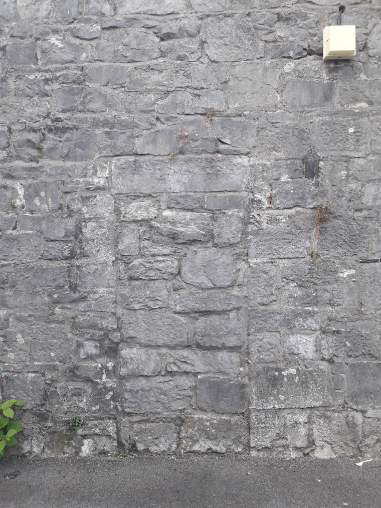 The now blocked-up doorway that is visible in the image of the IRA volunteer (Damian Shiels)